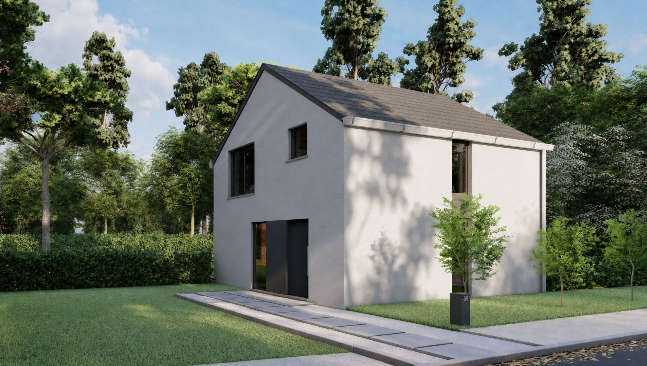 Une maison moderne à deux étages, au style épuré et à la façade grise, se dresse sur une pelouse verdoyante parsemée de jeunes arbres et bordée d'une allée en béton, entourée de grands arbres et d'arbustes, sous un ciel partiellement nuageux.